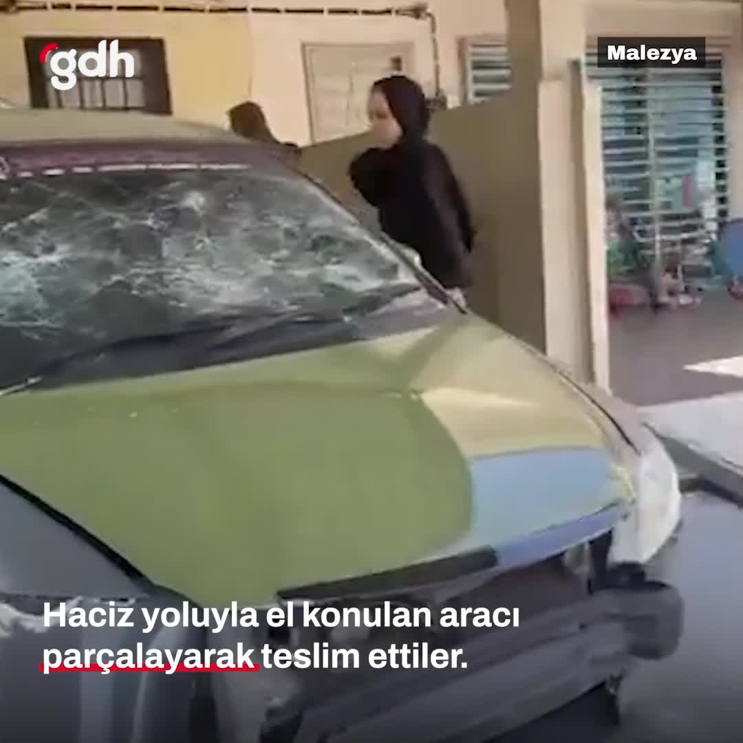 Kredi borcunu ödemeyen kadının aracı taşla parçalandı